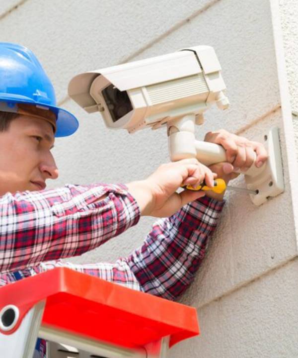 CCTV Security Camera Installation Perth technician fixing camera